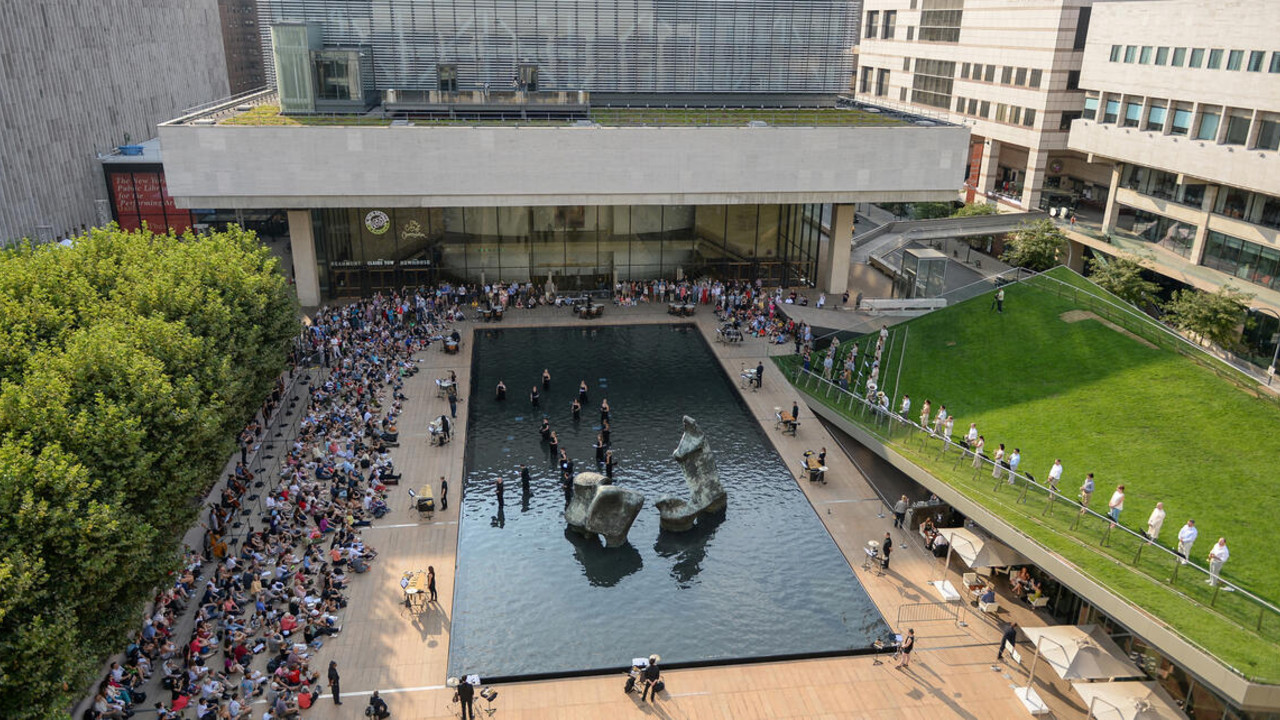 Lincoln Center plaza full of event attendees on a sunny day